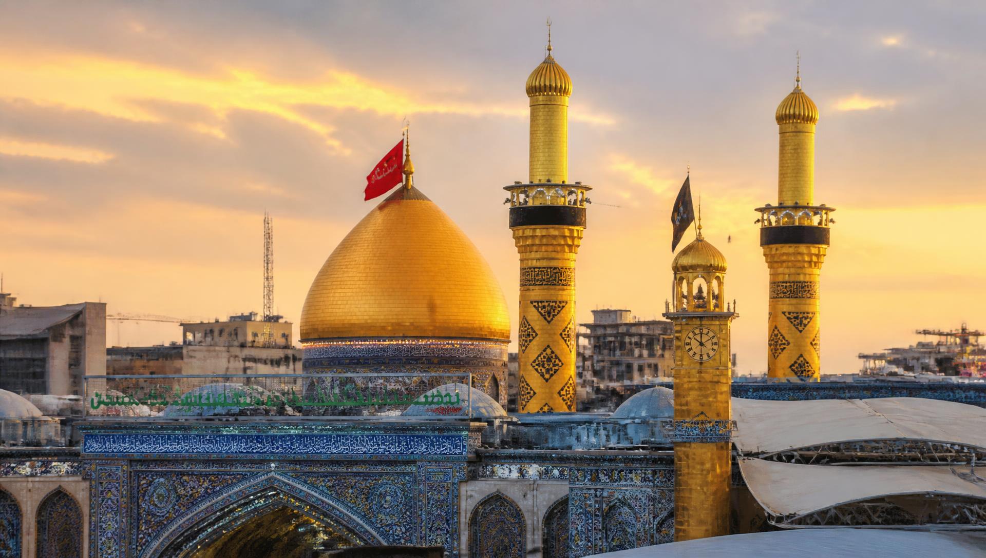 Golden dome of the holy shrine in Karbala, Iraq at sunset